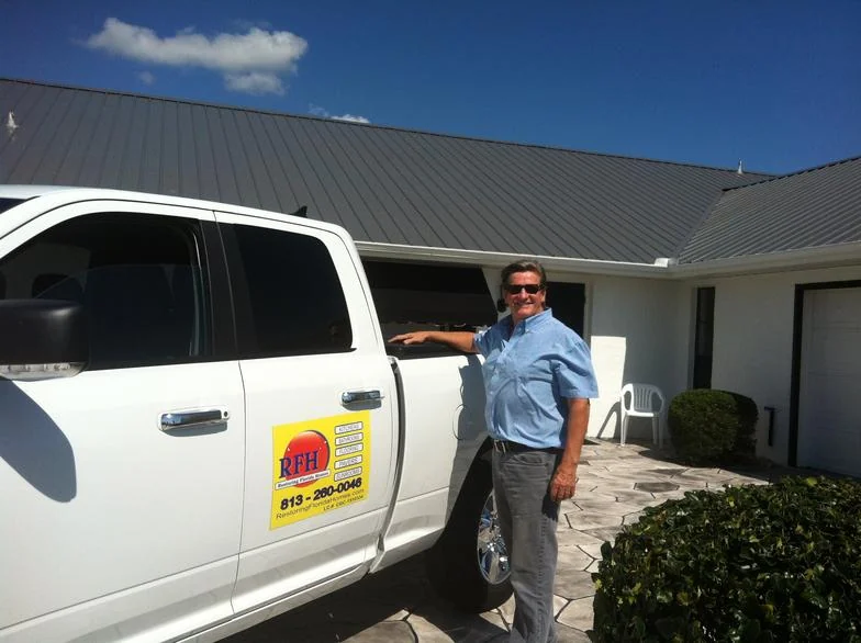 Robert Hoskinson beside an RFH Construction truck
