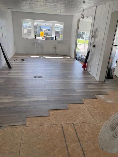 RFH project photo showing wood-look flooring installation in progress